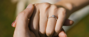 Hand wearing an engagement ring